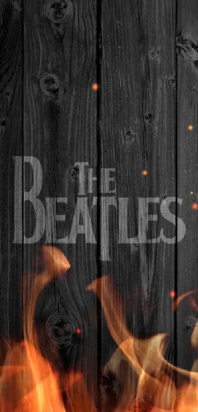 Vintage dark wood wallpaper with Beatles logo.