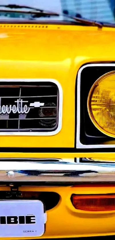 Vintage yellow car front view, close-up of headlight.