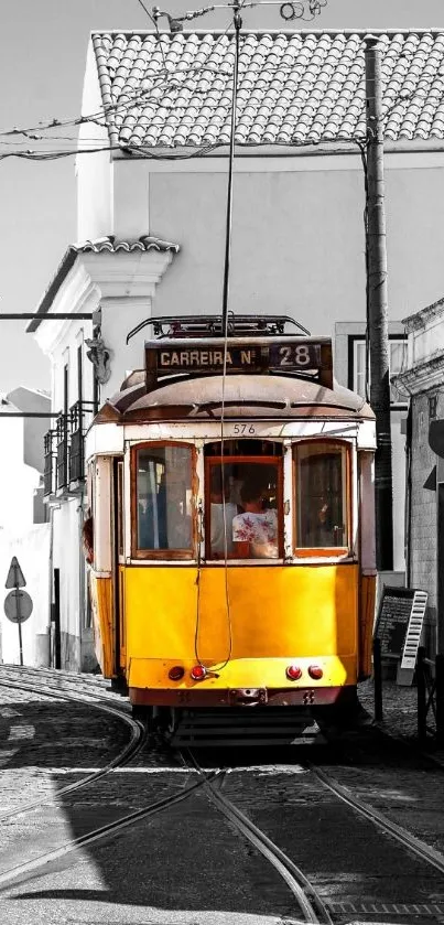 Vintage yellow tram on a monochrome urban backdrop.