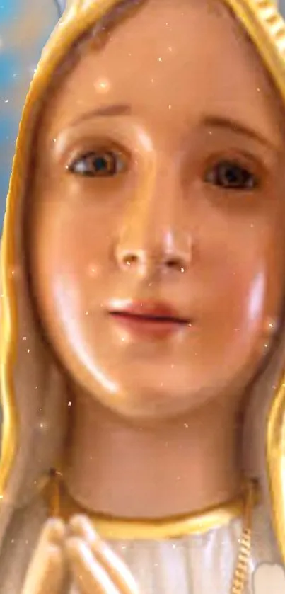 Virgin Mary statue in soft golden hues on a mobile wallpaper.