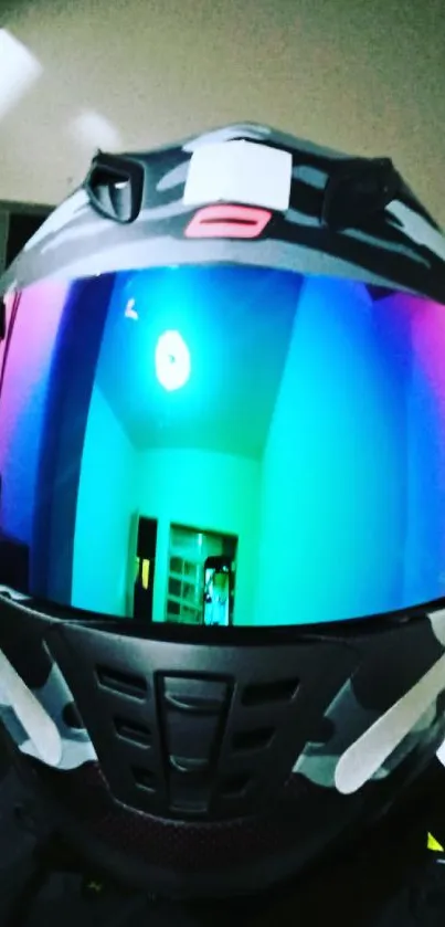 Motorcycle helmet with colorful reflective visor in modern setting.