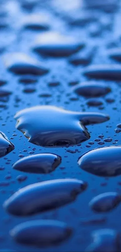 Close-up of vivid blue water droplets on a smooth surface.