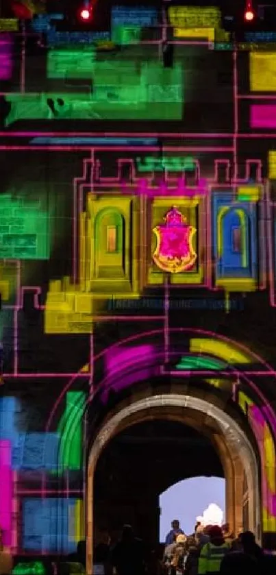 Colorful castle wall illuminated with geometric light patterns at night.