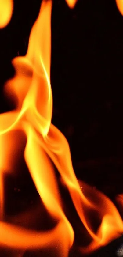 Mobile wallpaper with vivid orange flames on a dark background.