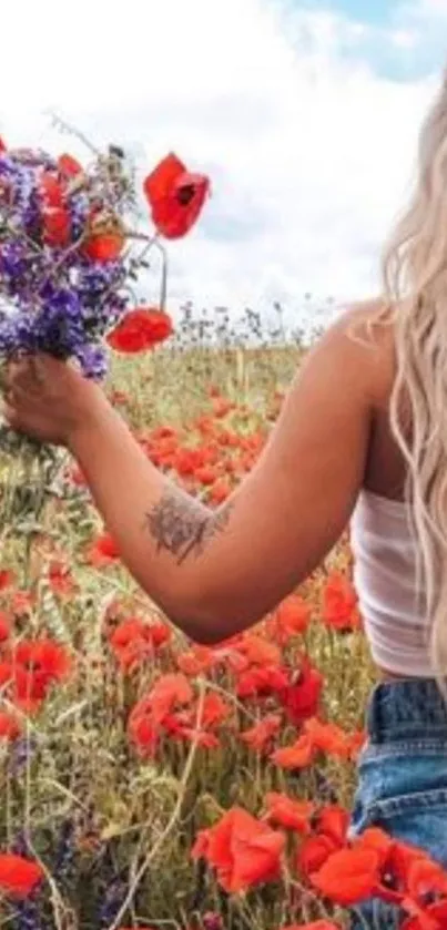 A woman in a field holding a bouquet of wildflowers under a cloudy sky.