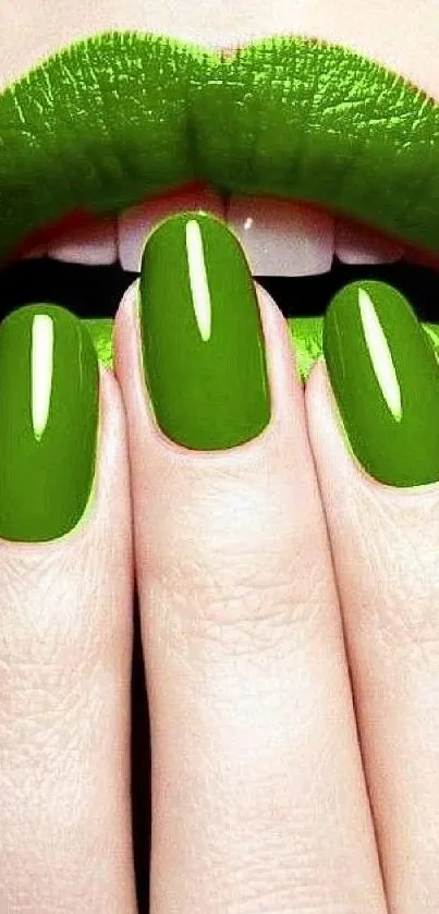 Close-up of green lipstick and nails art.