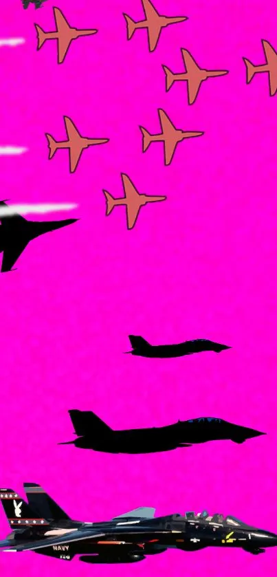 Silhouette of jets against a vibrant pink background.