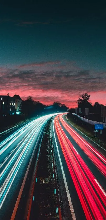 Vivid highway lights with sunset sky.