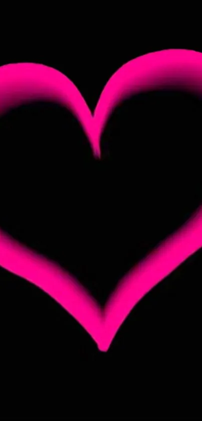 Glowing pink heart design on black background wallpaper.