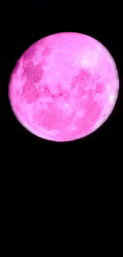 Vivid pink moon against a dark sky background.