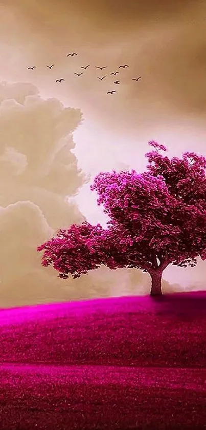 Vivid pink tree on a grassy hill under cloudy sky.