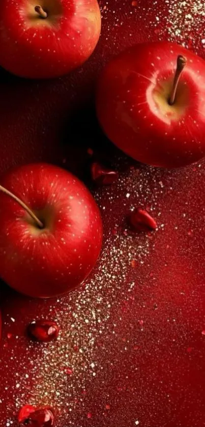 Vibrant red apples on a textured background.