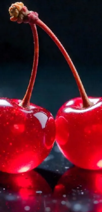 Glossy red cherries on a dark background.
