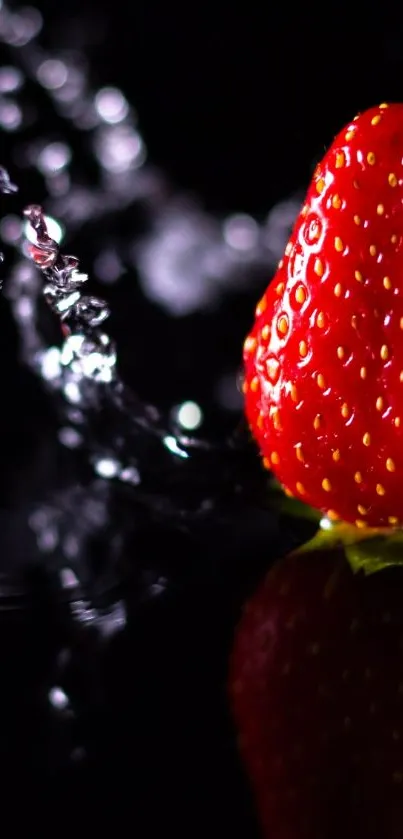 Vibrant strawberry with water splash on dark background.