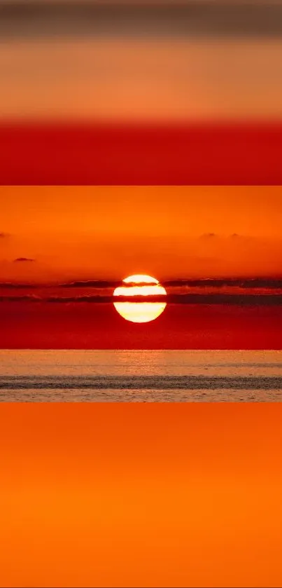 Vibrant sunset over calm ocean with orange-red hues and serene horizon.