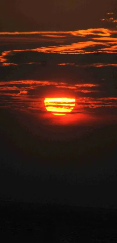 Vibrant sunset with orange and red sky hues.