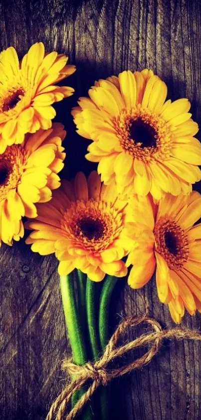 Yellow gerbera flowers over rustic wood