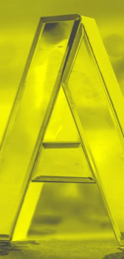 Yellow glass letter 'A' on abstract background.