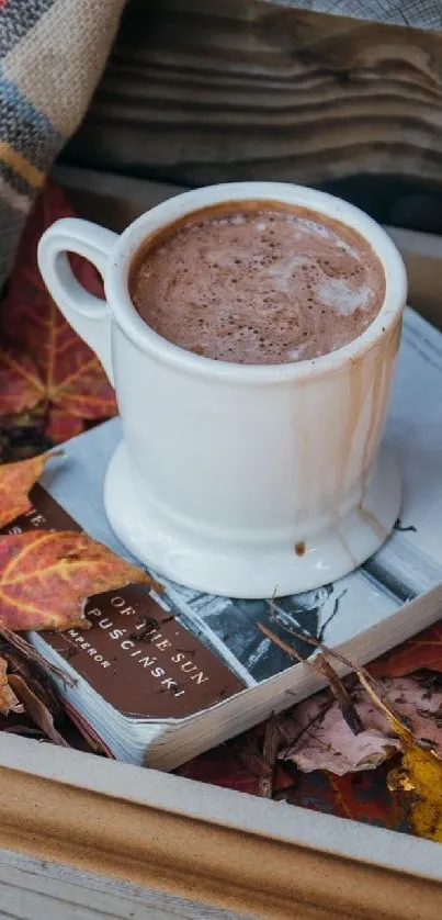 A cozy scene with a coffee cup and autumn leaves on a book.