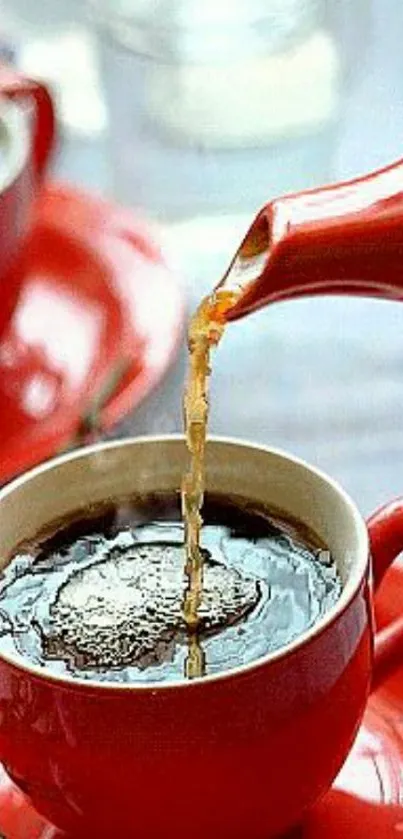 Pouring coffee into red cup with saucer, vibrant and warm scene.