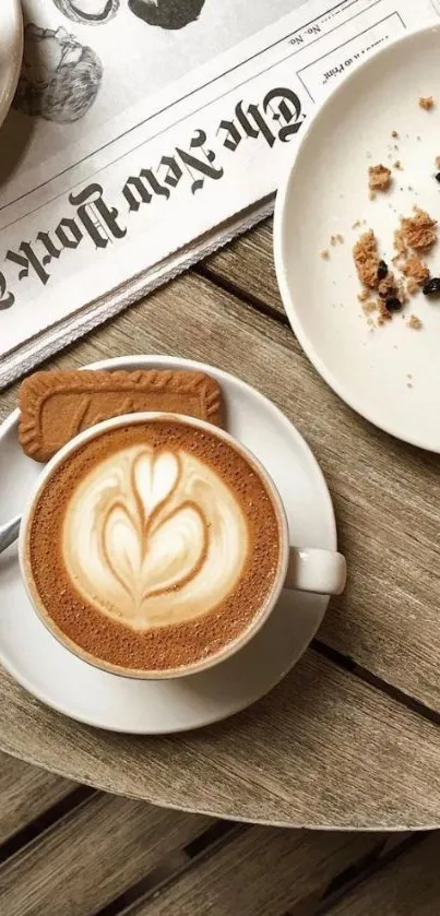 Rustic coffee latte scene with biscuit and newspaper on wooden table.