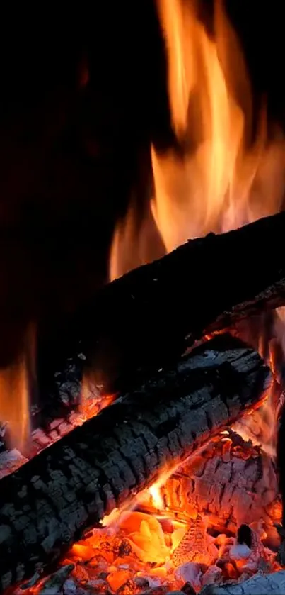 A cozy fireplace with glowing logs and dancing orange flames.