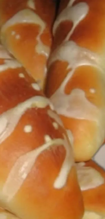 Glazed bread rolls with a golden crust.