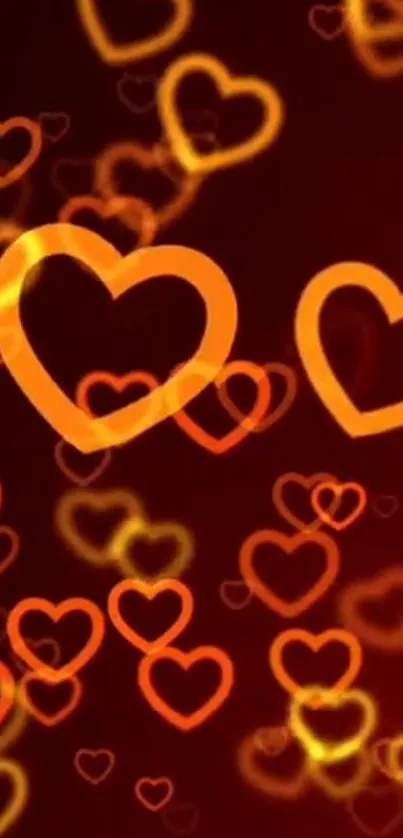 Wallpaper with glowing orange hearts on a dark background.