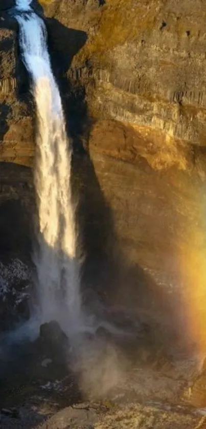 Majestic waterfall cascading with rainbow lighting scenery.