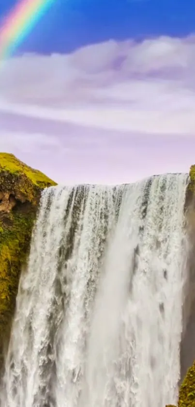 Scenic waterfall with rainbow and lush greenery in the background.