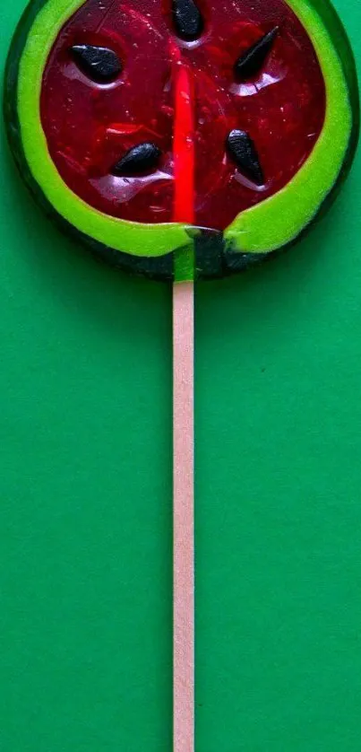 Watermelon lollipop on vibrant green background wallpaper.