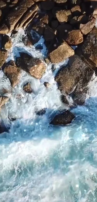 Aerial view of waves crashing on rocky shoreline in vibrant blue hues.