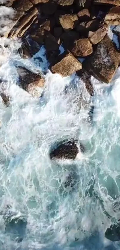 Rocks meet crashing ocean waves, capturing nature's raw power.