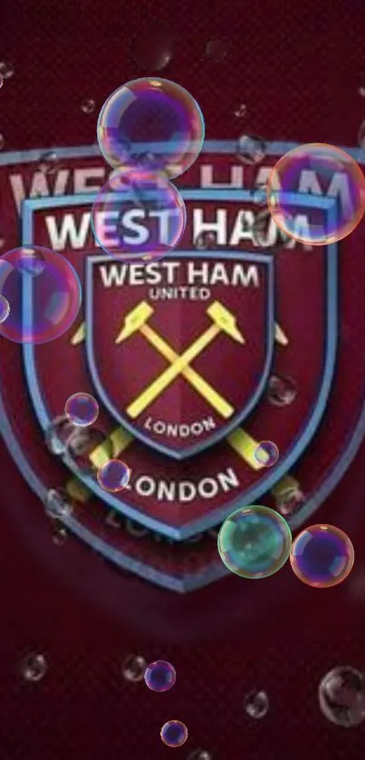 West Ham crest with bubbles on maroon background.