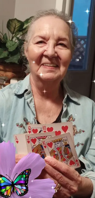 Joyful woman holding cards with a butterfly and floral design.