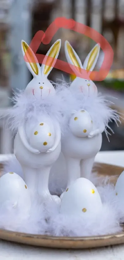 Easter bunnies with fluffy feathers and decorative eggs on a plate.