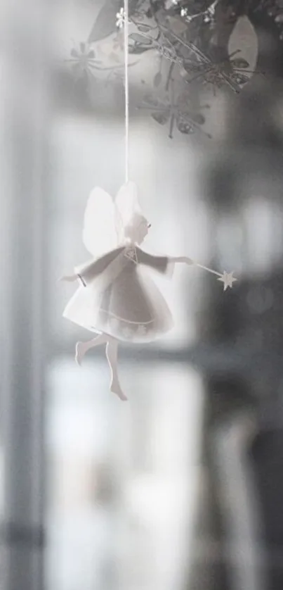 A delicate fairy figure hanging as a dreamy mobile wallpaper.