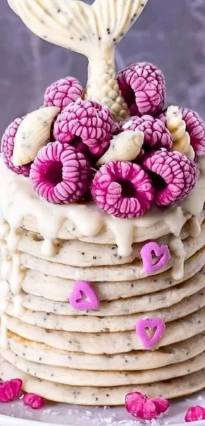 Whimsical pancake stack with mermaid tail and pink toppings.