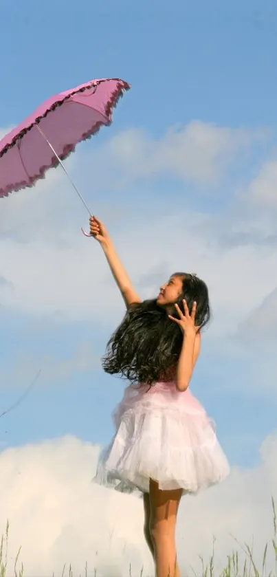 Girl in white dress holding pink umbrella against blue sky.