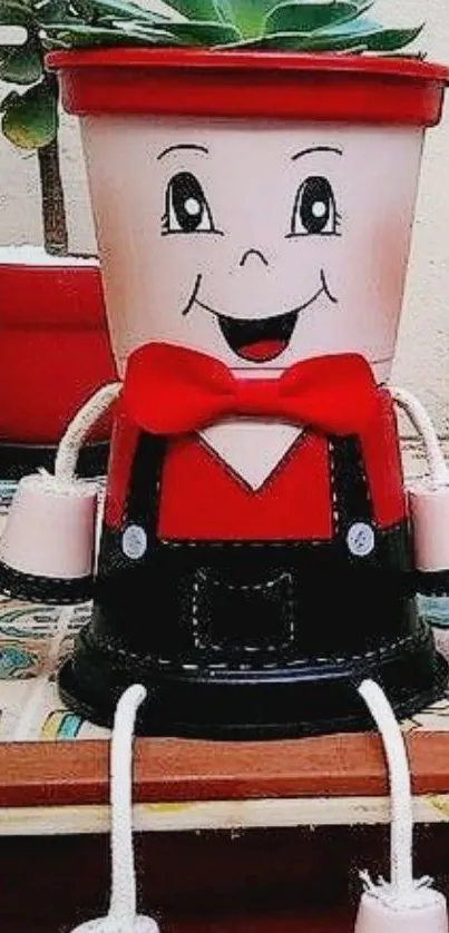 Whimsical planter with smiling face and red accents on a decorative table.