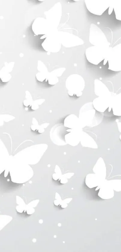 White paper butterflies on gray background wallpaper.