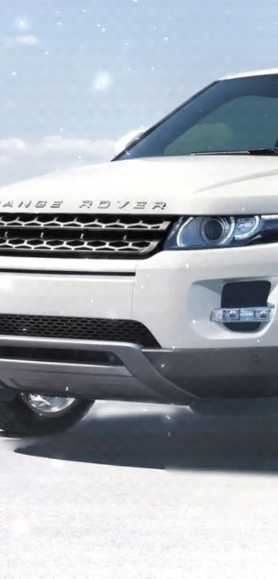 White luxury SUV against a snowy winter backdrop.