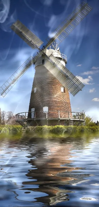 Windmill reflecting on water under a clear blue sky, creating a serene mobile wallpaper.