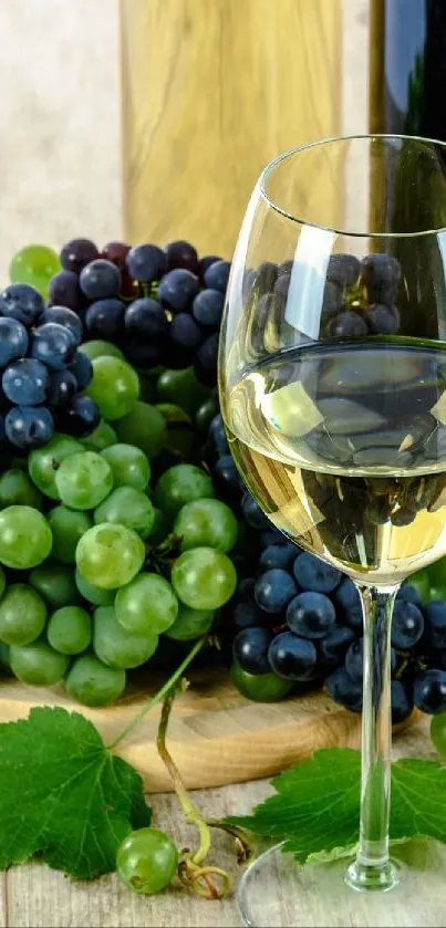 Wine glasses with grapes and a barrel on a wooden table.