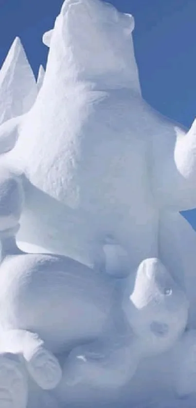 Polar bear snow sculpture under clear blue sky.