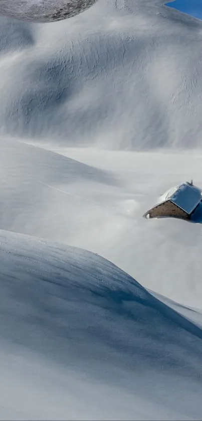 Lone cabin surrounded by snow-covered hills under a blue sky.