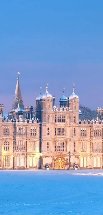Winter castle with sunset sky and snow-covered grounds.