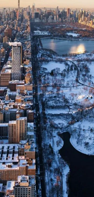 Aerial cityscape with snow and park under winter sunlight.