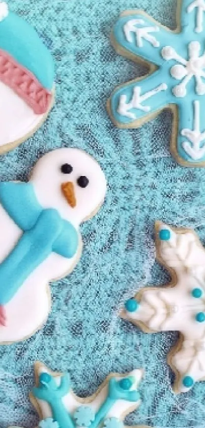 Winter-themed cookie wallpaper with snowflakes and snowmen on a blue background.