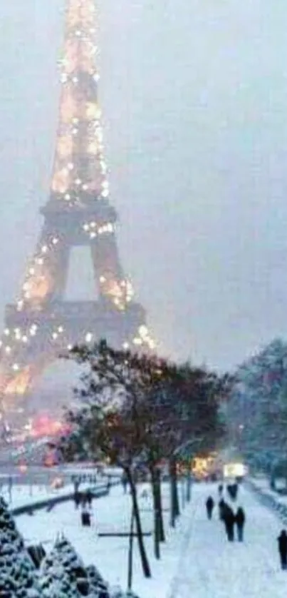 Eiffel Tower in winter with snow-covered paths and twinkling lights.